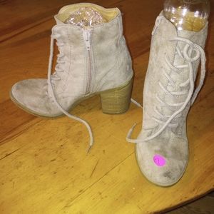 Brown laced up boots with heels